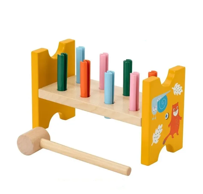Developmental wood toy with hammer and pegs